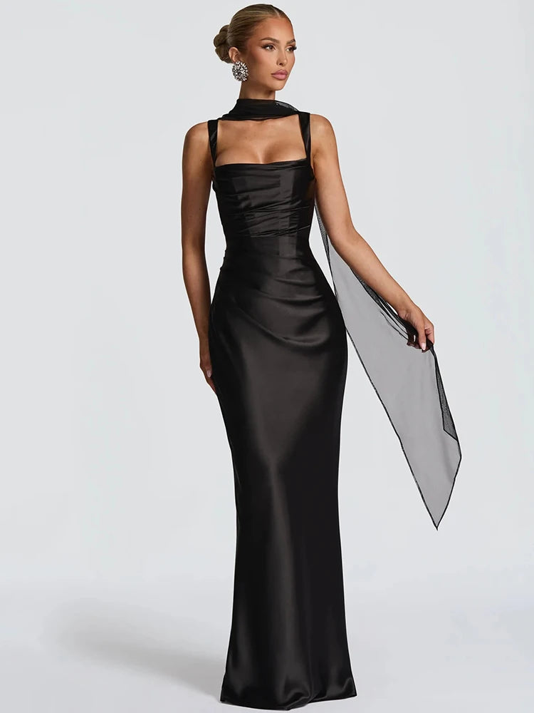 Black backless maxi dress with square halter neckline, fitted satin silhouette
