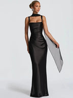 Black backless maxi dress with square halter neckline, fitted satin silhouette