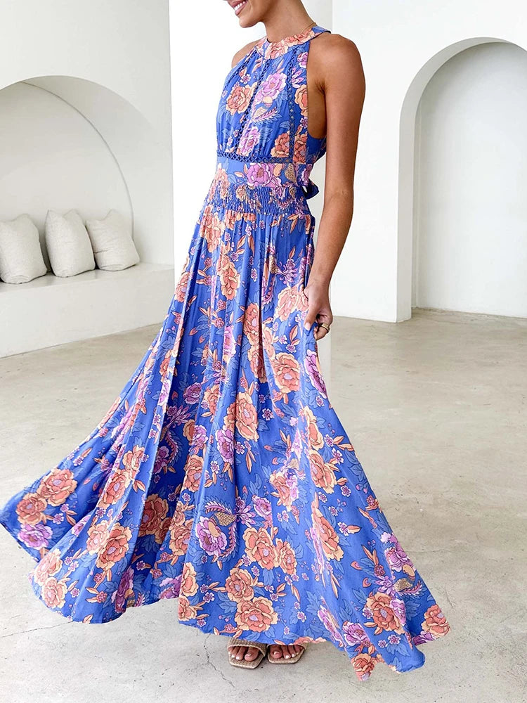 Blue floral sleeveless maxi dress with smocked waist and tiered flowing skirt