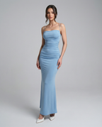 Light blue spaghetti strap maxi dress with gathered bodice and long fitted skirt.