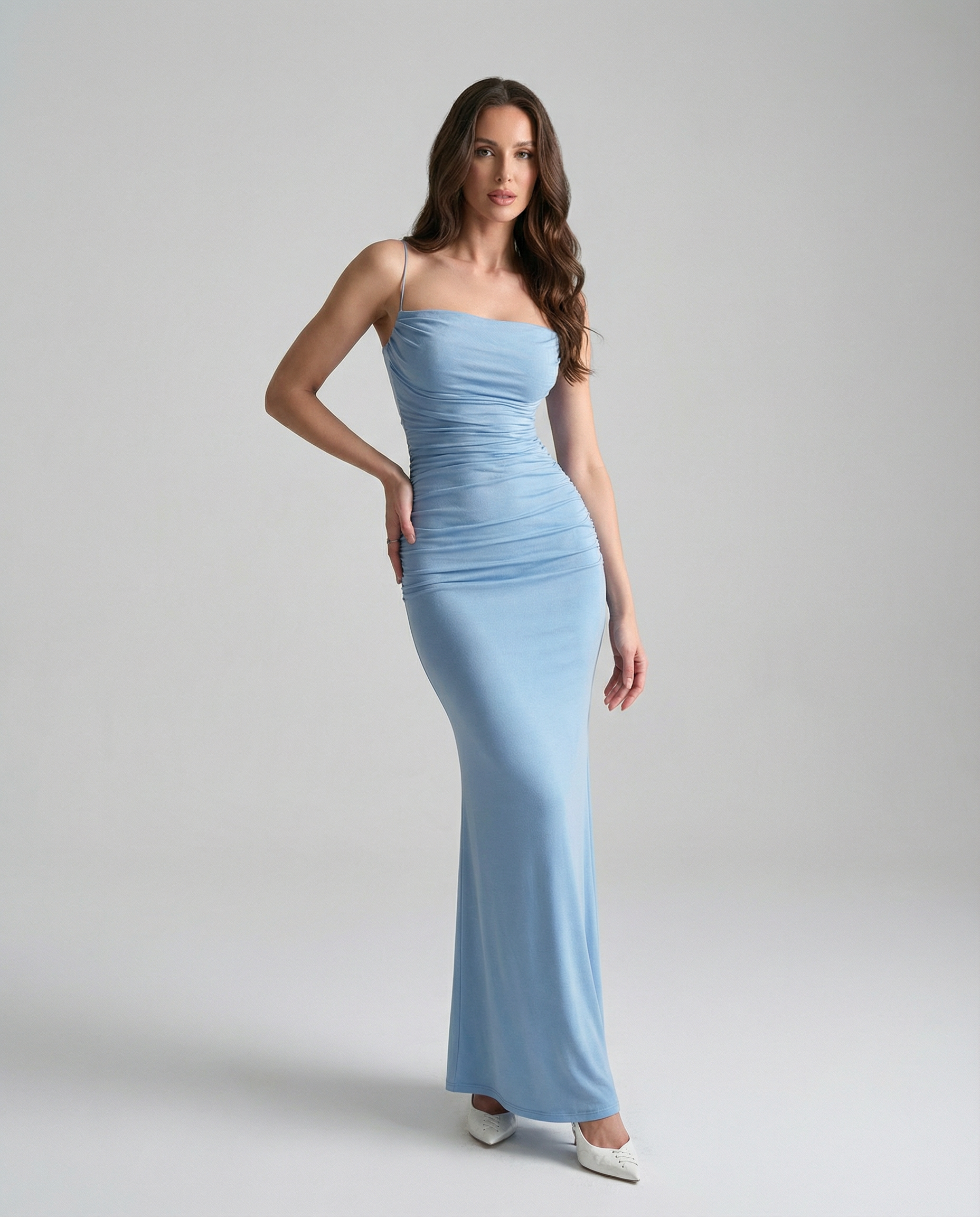 Light blue spaghetti strap maxi dress with ruched center and mermaid-style hem.