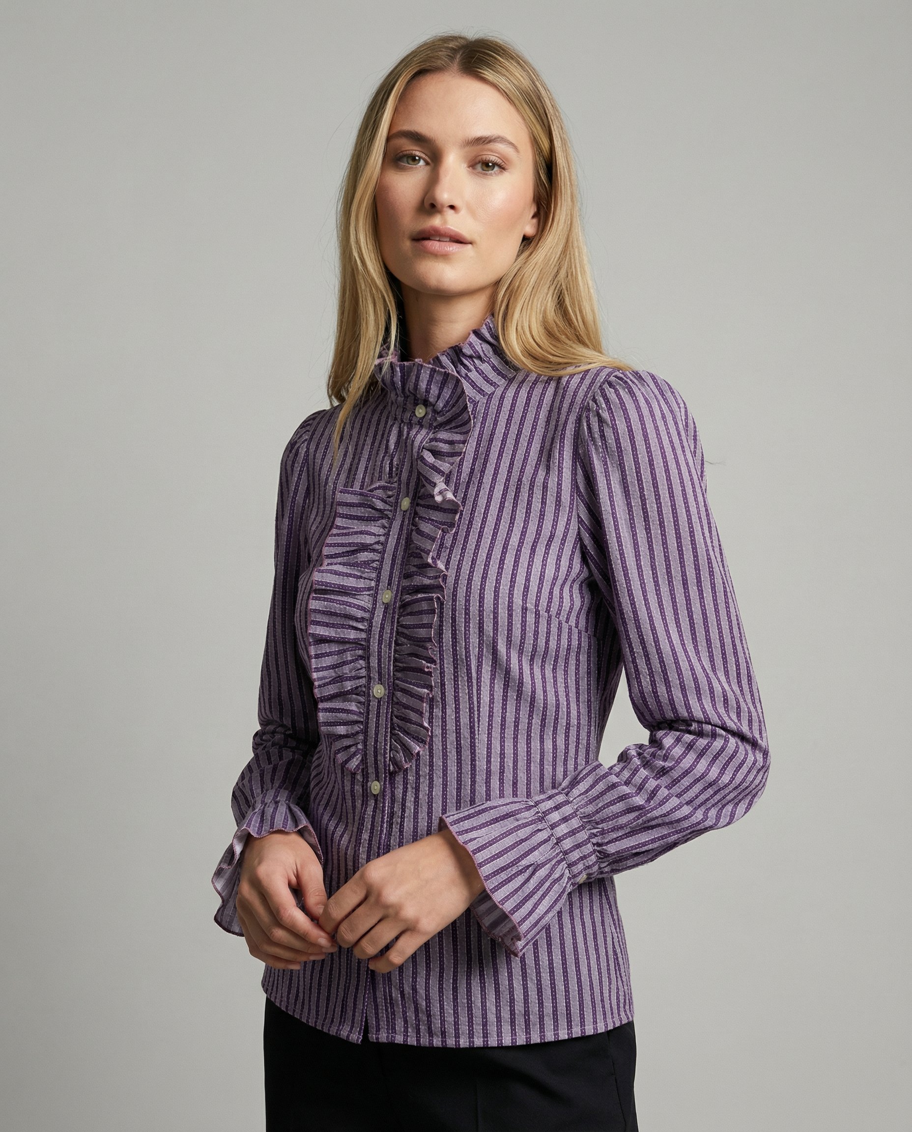 Women’s striped blouse with high neck ruffles, button front, and cuffed sleeves