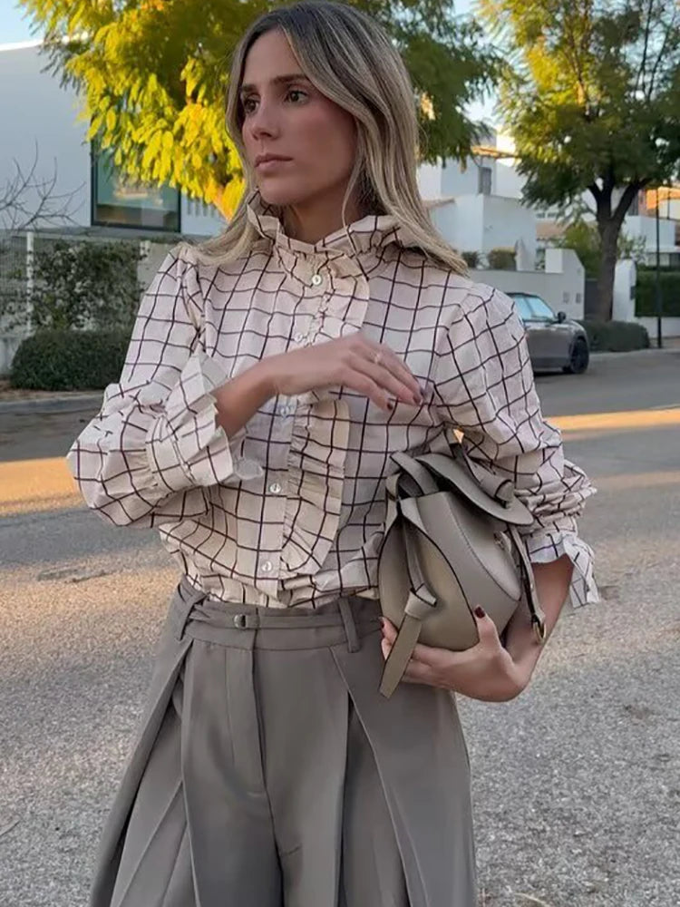 Women’s checked blouse with high neck, ruffled front, and button placket