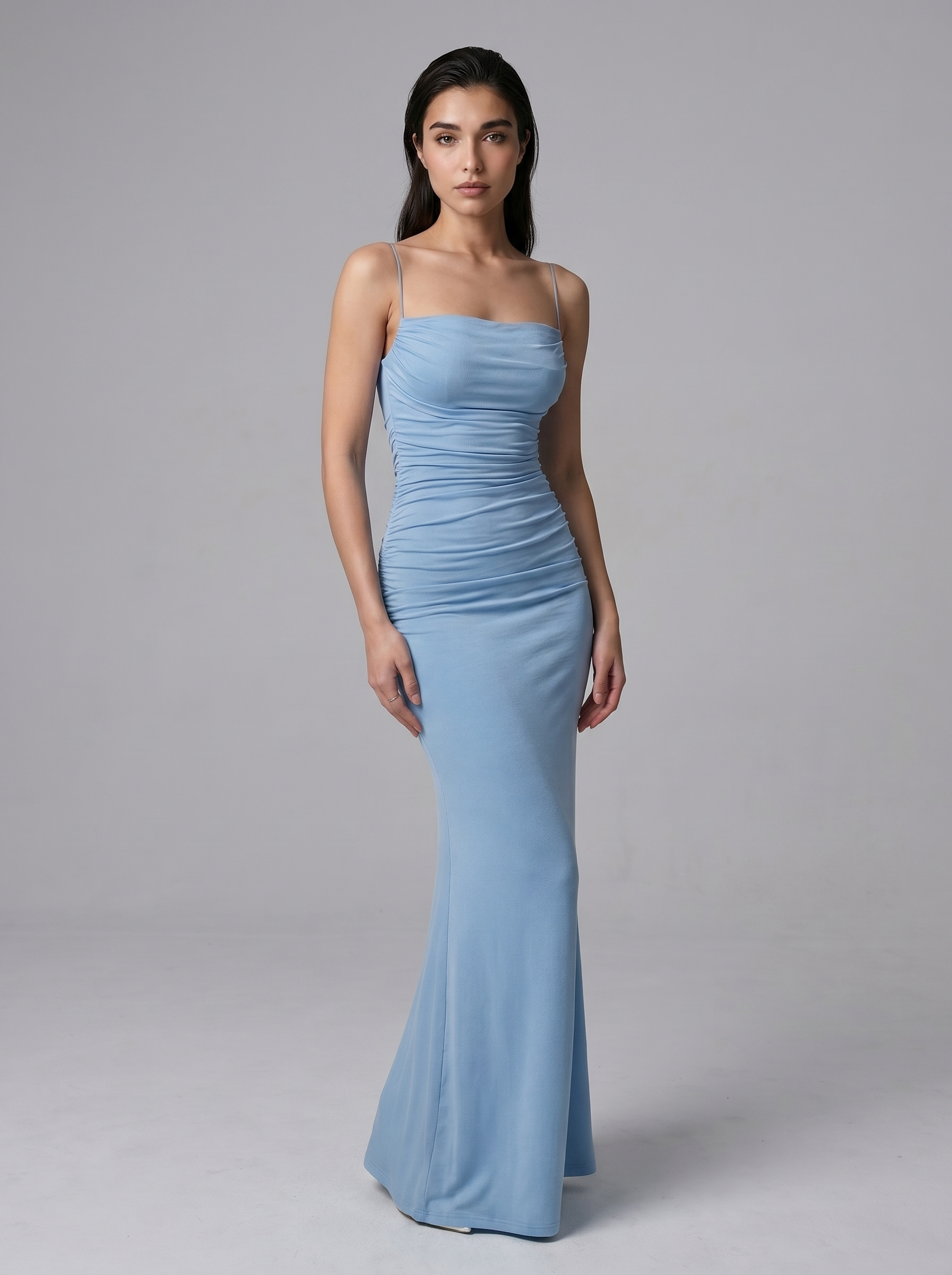 Light blue spaghetti strap maxi dress with ruched detailing and flared bottom hem.