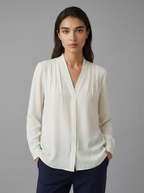 Ivory puff-sleeve blouse with tailored defined waist, V-neck front