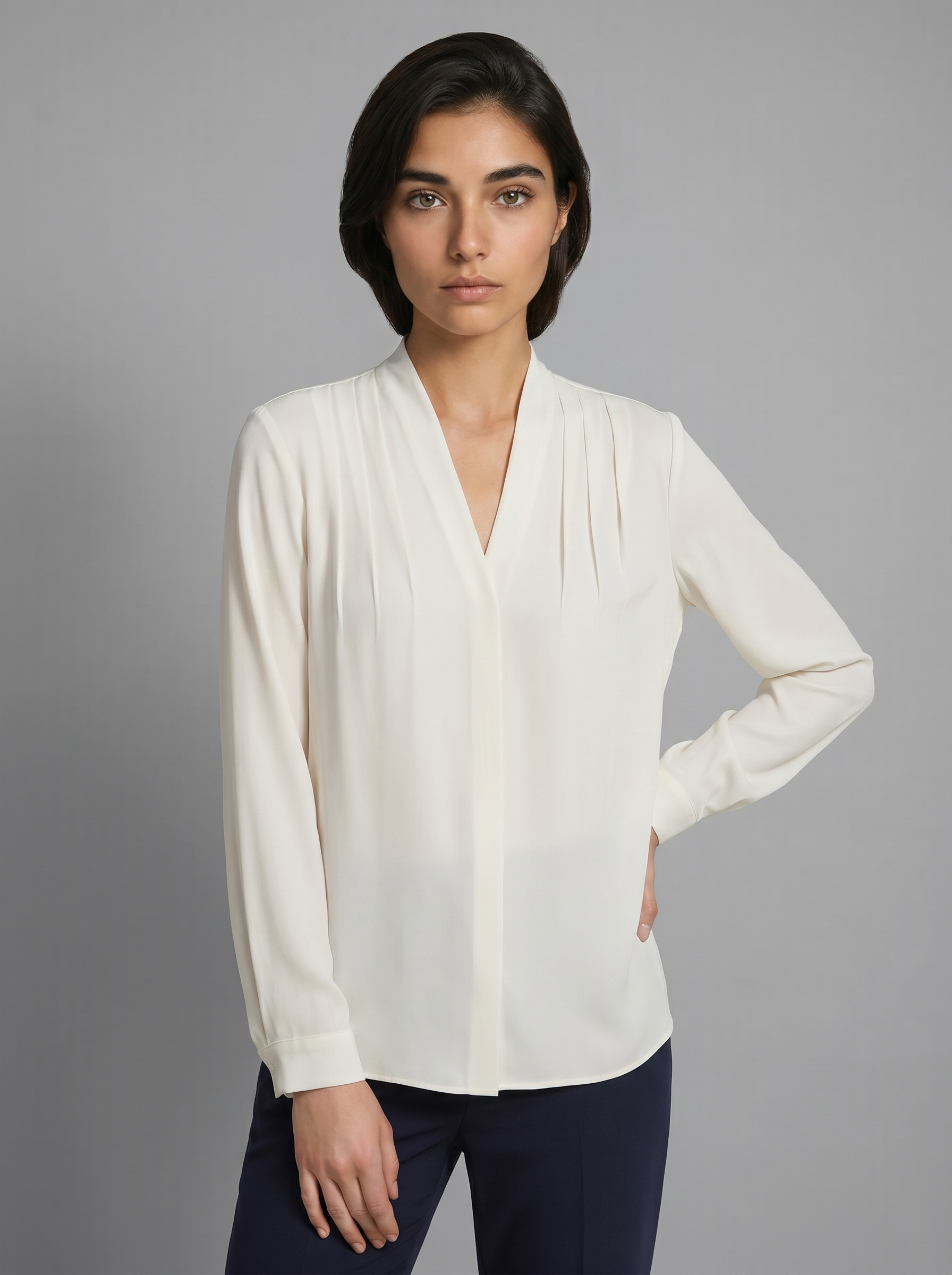 Ivory V-neck puff-sleeve blouse with defined waist seam and long sleeves