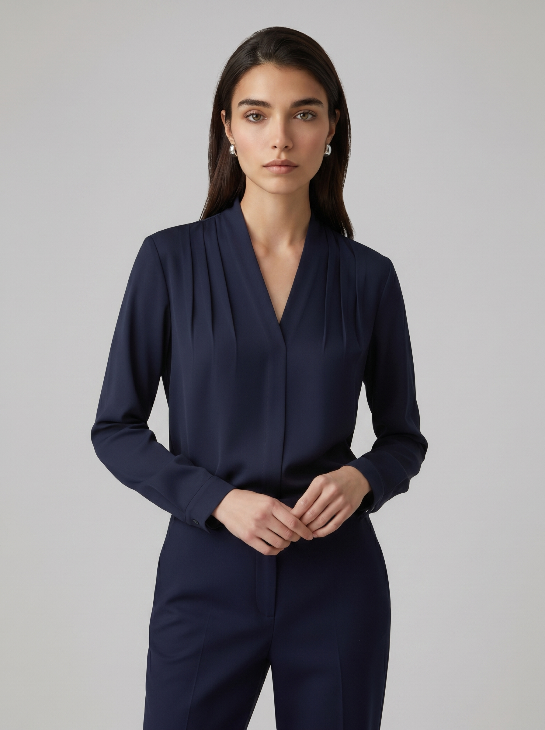 Navy blue puff-sleeve blouse with tailored defined waist and V-neck front