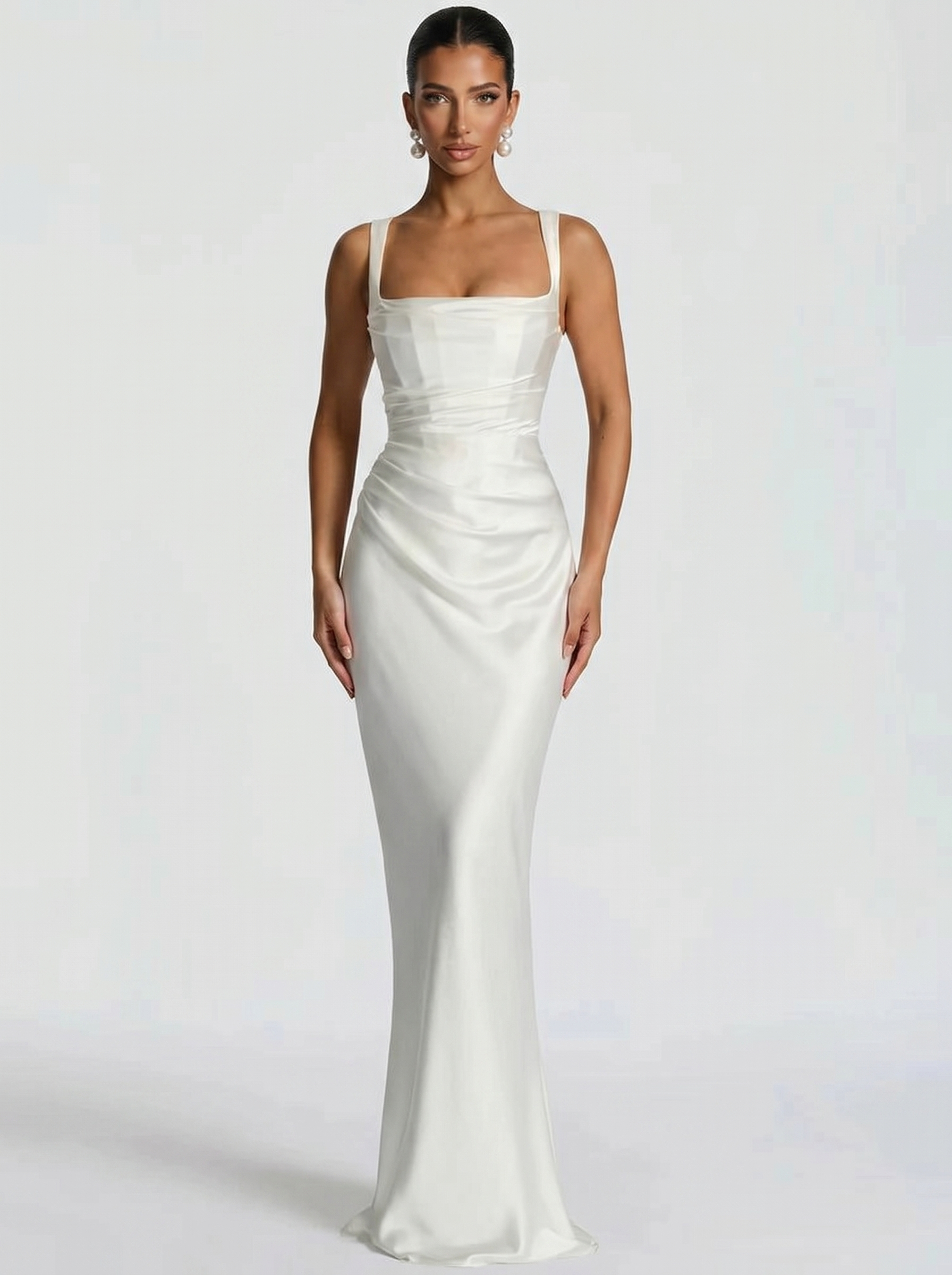 White backless maxi dress with square halter neckline, fitted satin with draped side detail