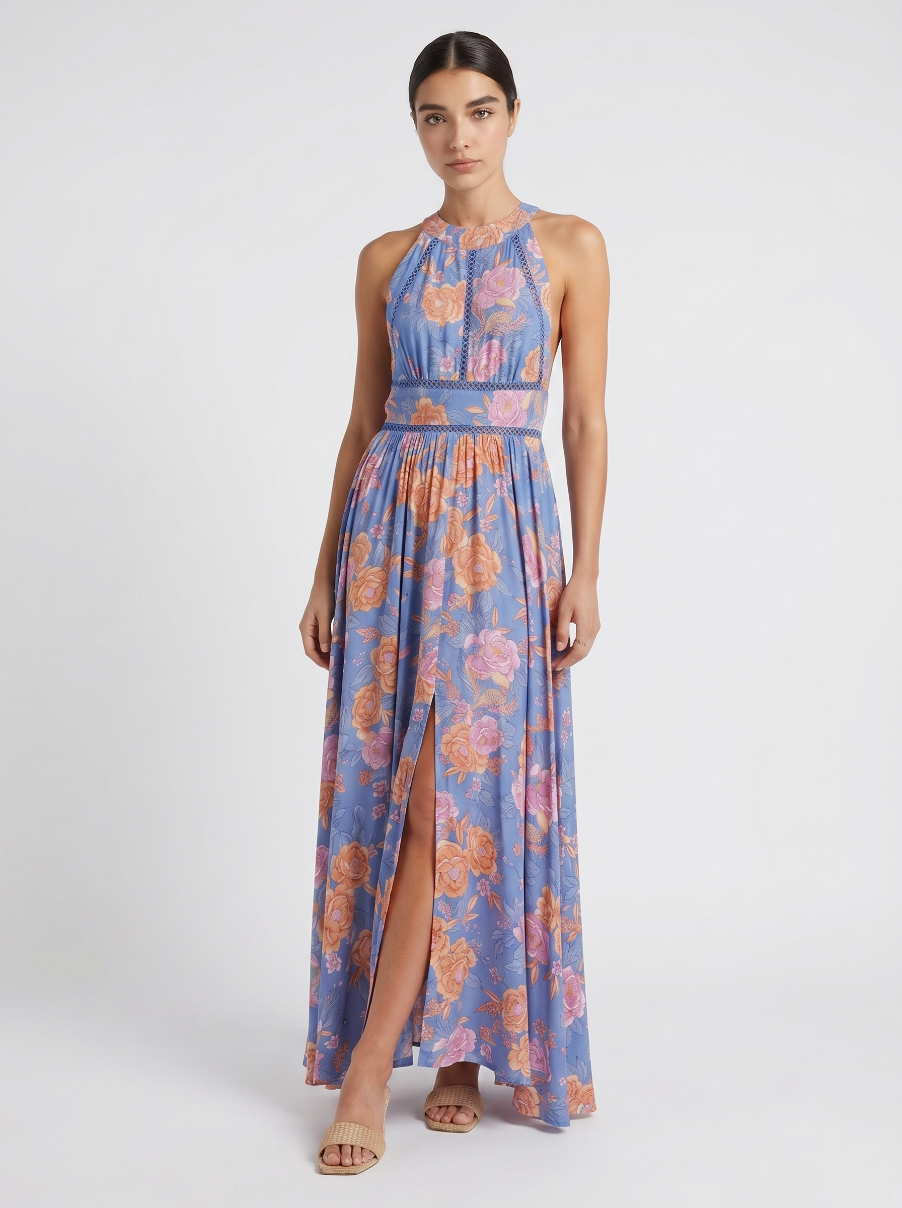 Blue floral sleeveless maxi dress with high neckline and front leg-slit detail