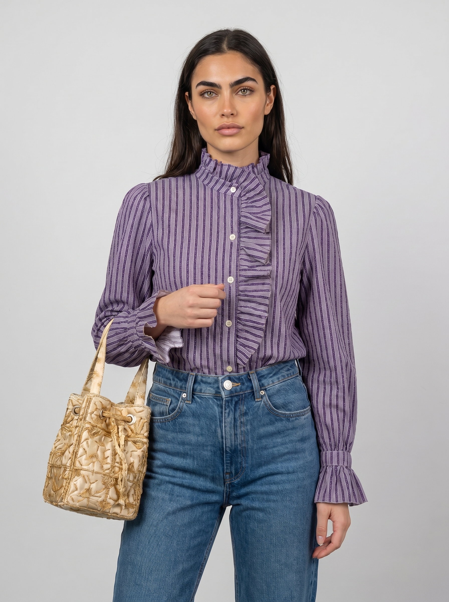 Women’s striped blouse with high neck ruffle detail and long cuffed sleeves