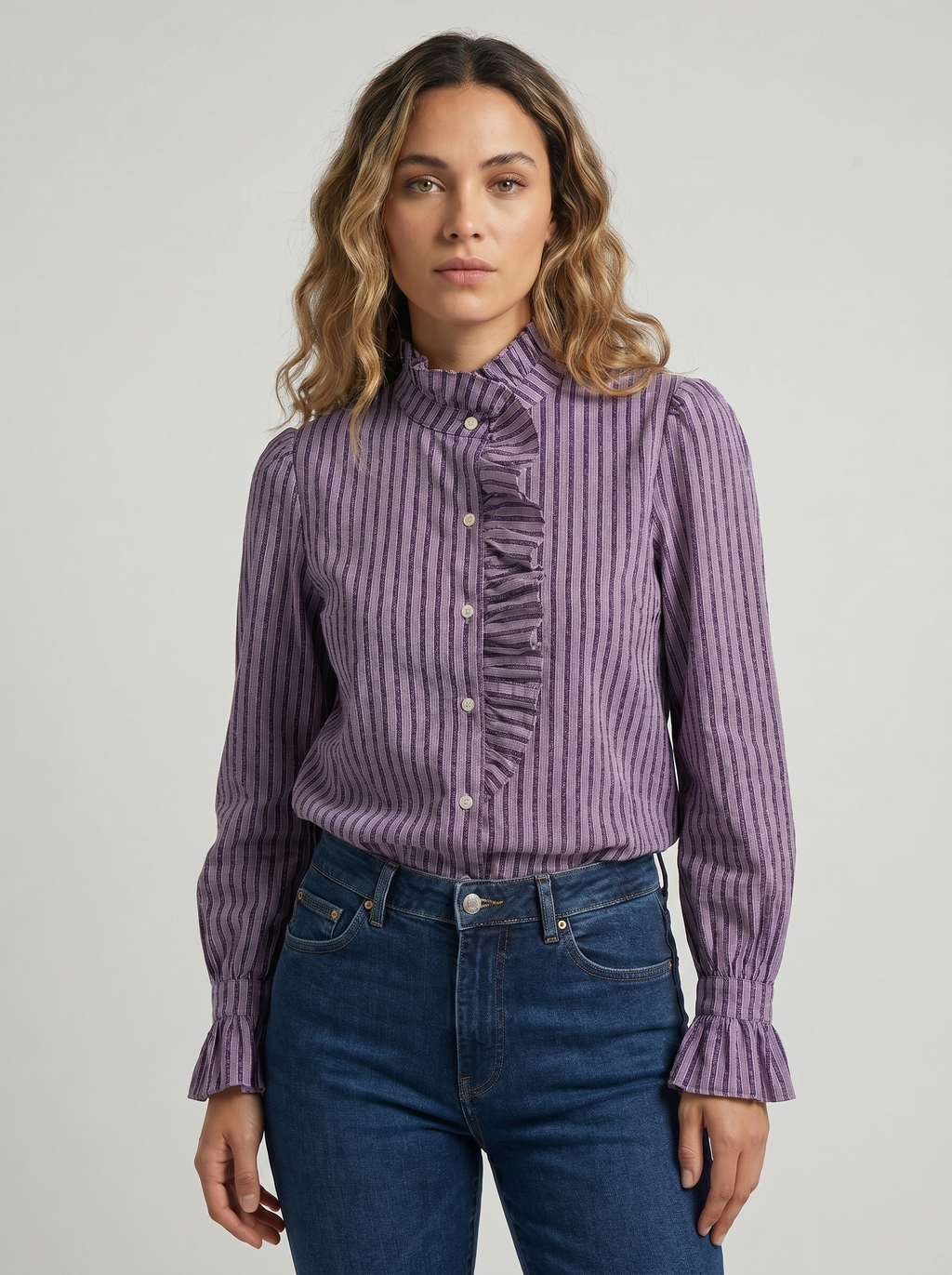 Women’s striped blouse with high neck, ruffled front trim, and button placket