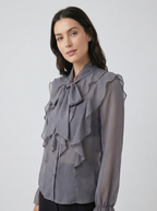 Gray chiffon blouse with ruffle bib front and tie-neck, long sheer sleeves