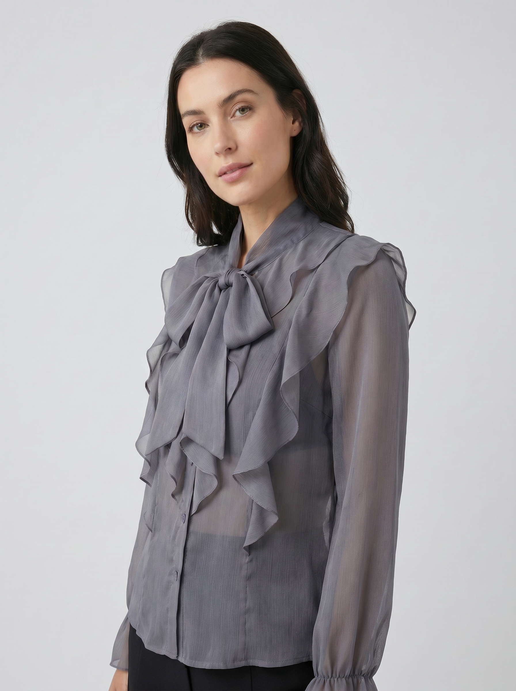 Gray chiffon blouse with ruffle bib front and tie-neck, long sheer sleeves