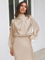 Beige satin evening dress with long sleeves, high neck, midi length