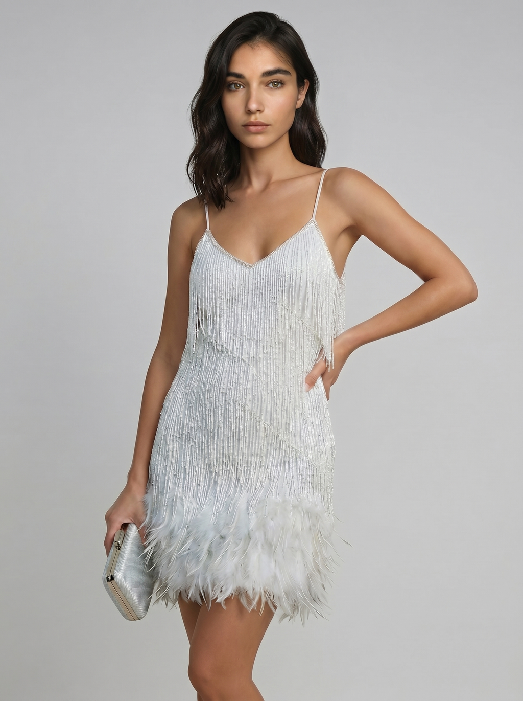 Silver mini dress with spaghetti straps and feather fringe hem, V-neck front