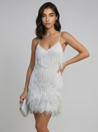Silver mini dress with spaghetti straps and feather fringe hem, V-neck front