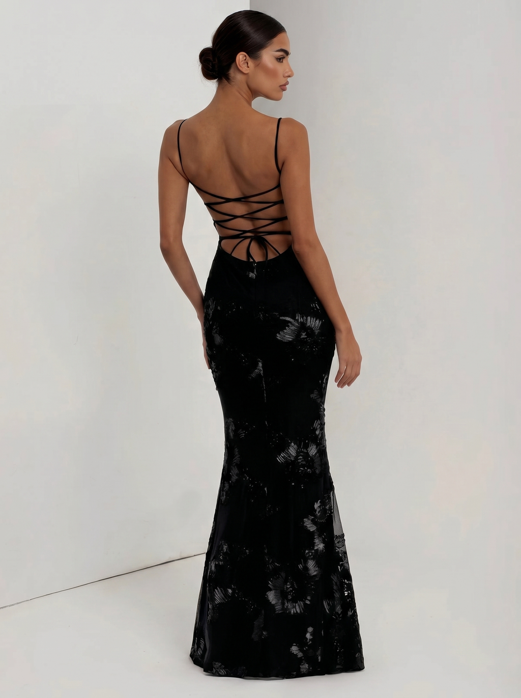 Black floral evening dress with crisscross open back and fitted mermaid silhouette