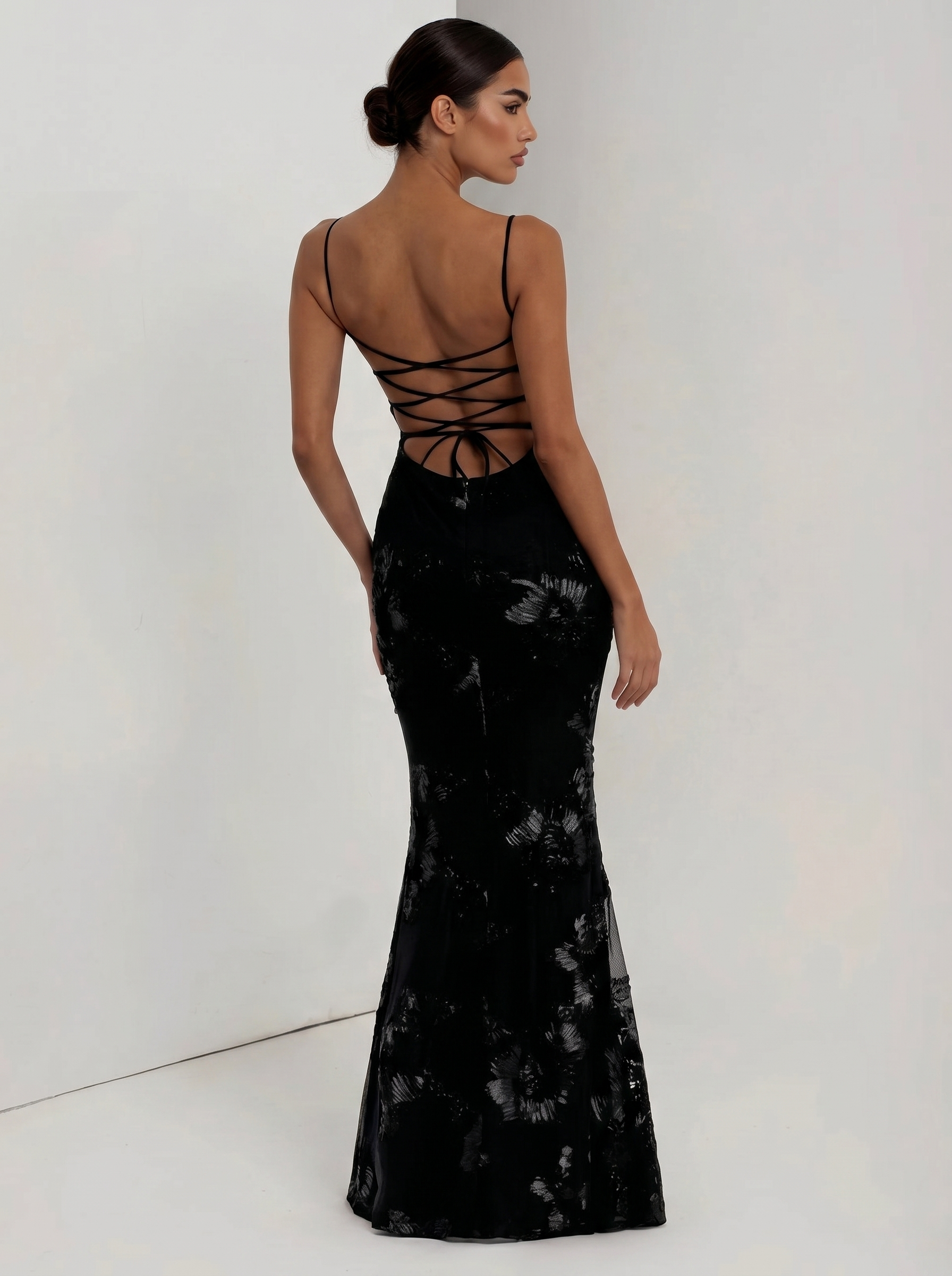 Black floral evening dress with crisscross open back and fitted mermaid silhouette