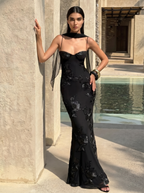 Black floral evening dress with sheer neckline overlay and fitted mermaid skirt