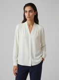 Ivory puff-sleeve blouse with tailored defined waist, V-neck front