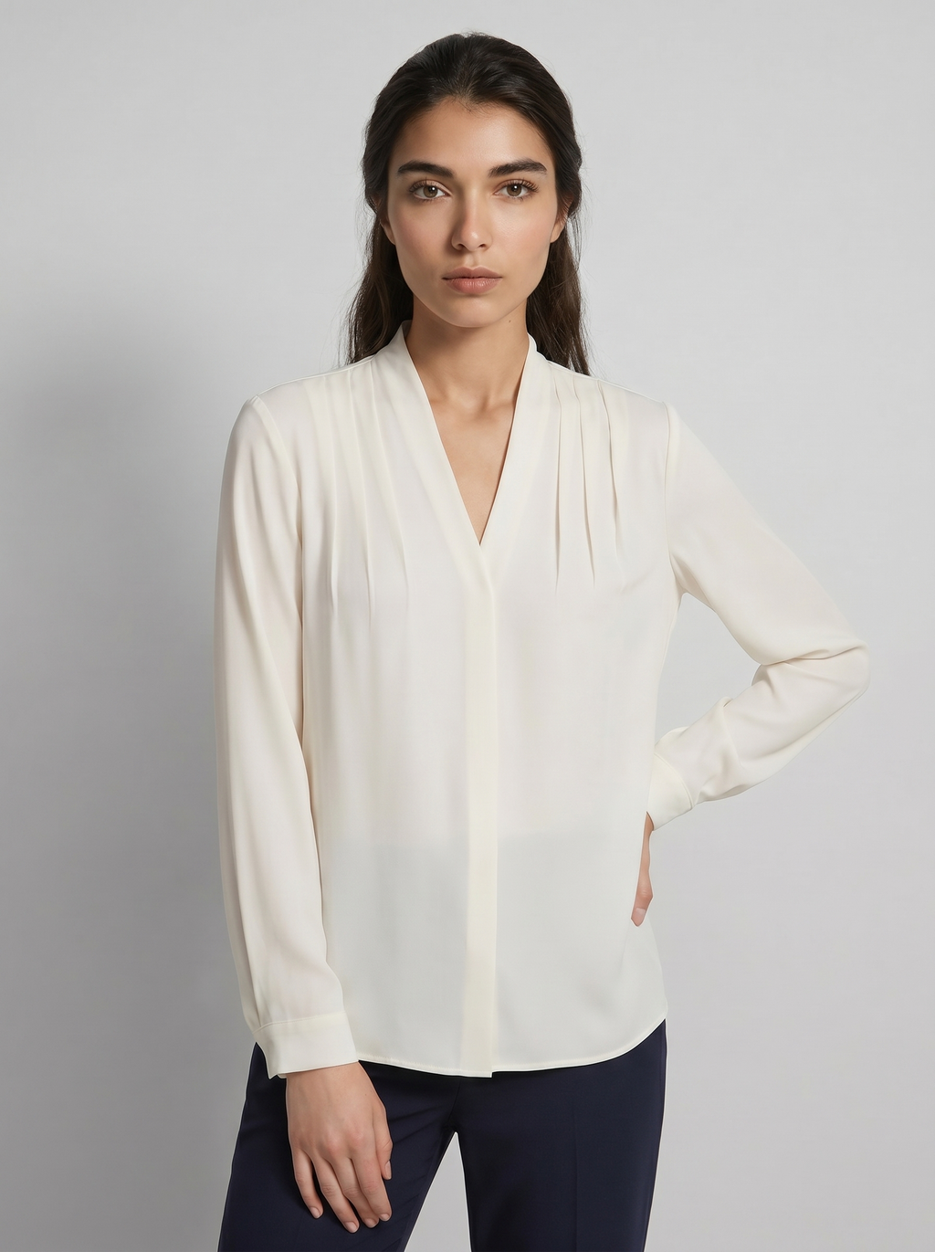 Ivory V-neck puff-sleeve blouse with defined waist seam and long sleeves