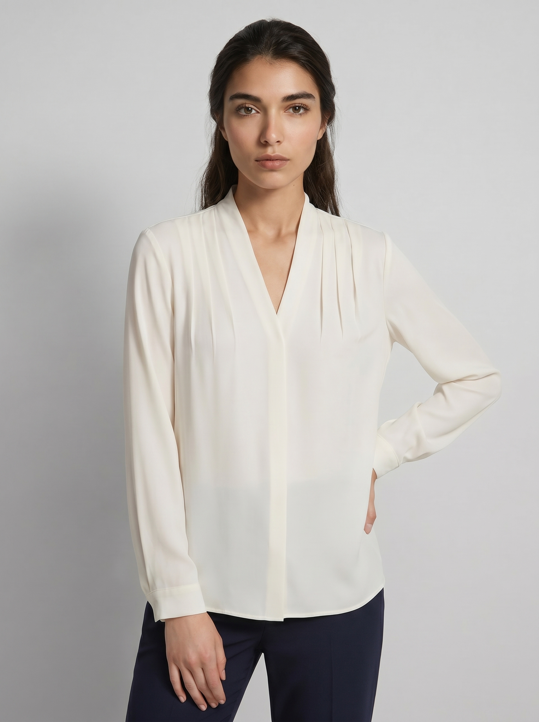 Ivory V-neck puff-sleeve blouse with defined waist seam and long sleeves