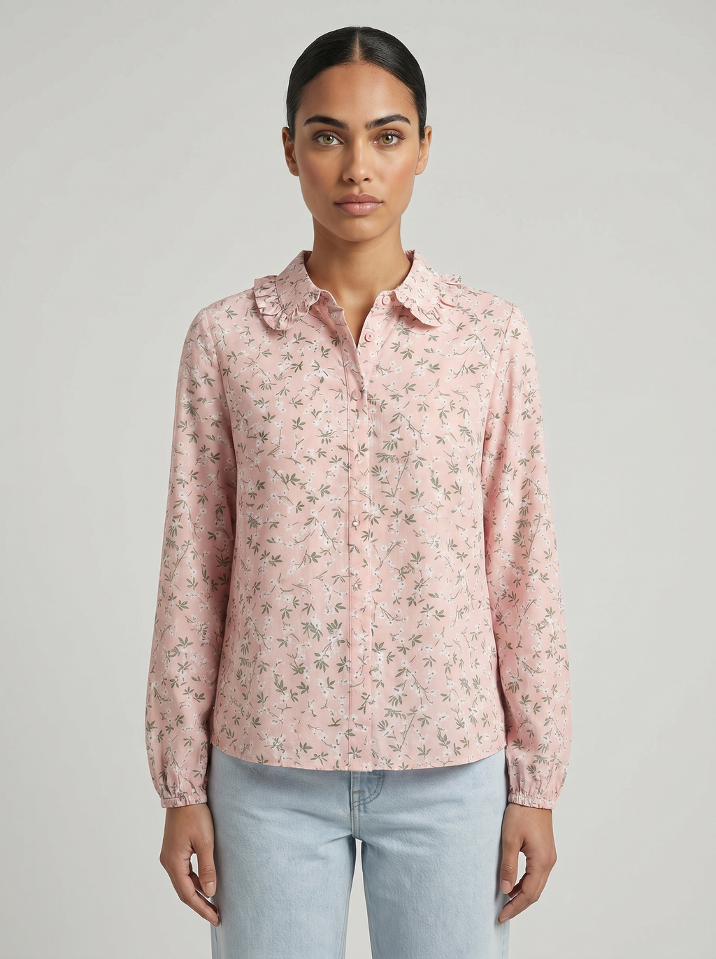 Pink floral blouse with ruffle collar, long sleeves, and button-back detail